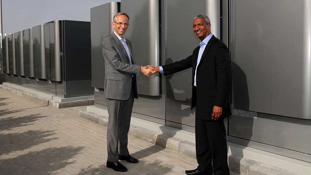 Ferrari CEO Benedetto Vigna shakes hands with Bloom Energy at Ferrari hydrogen Maranello Plant July 2024