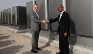 Ferrari CEO Benedetto Vigna shakes hands with Bloom Energy at Ferrari hydrogen Maranello Plant July 2024