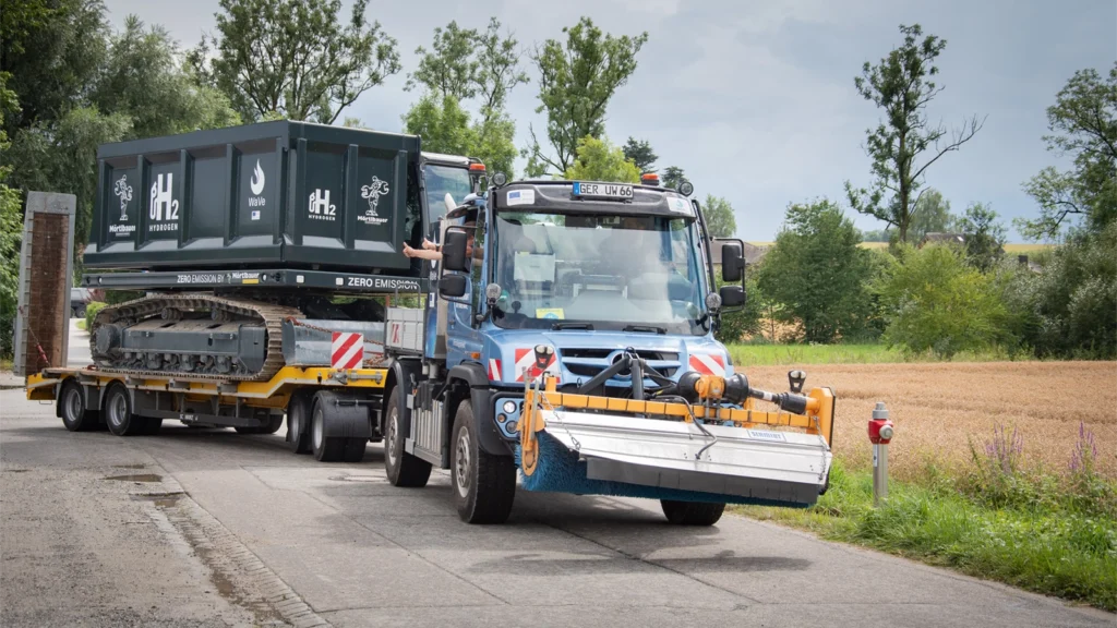 Mercedes Benz Special Trucks Unimog hydrogen internal combustion engine successful trial backed by wave project German Government Ministry for Economic Effairs BMWK towing the Mortlbauer Crawler Dumper