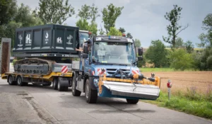 Mercedes Benz Special Trucks Unimog hydrogen internal combustion engine successful trial backed by wave project German Government Ministry for Economic Effairs BMWK towing the Mortlbauer Crawler Dumper