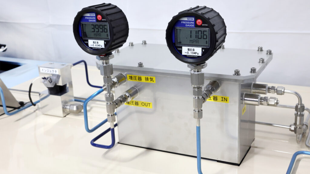 Self-pressuriser for increasing the pressure of boil-off gas - The meter on the left displays pressure after the increase, and the meter on the right displays pressure before the increase Toyota GR Corolla Hydrogen - Driving Hydrogen November 2024