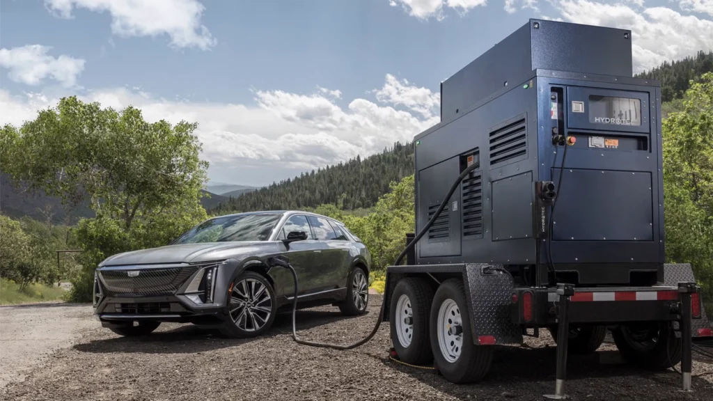 A GM HYDROTEC hydrogen-powered mobile charger, plugged into a Cadillac LYRIQ.