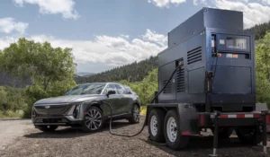 A GM HYDROTEC hydrogen-powered mobile charger, plugged into a Cadillac LYRIQ.