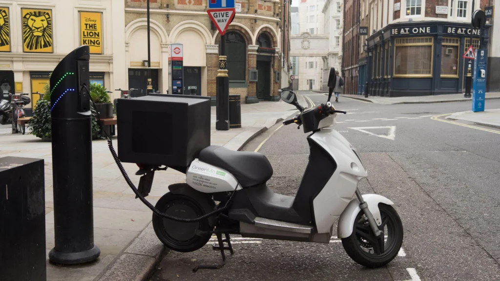 Electric moped charging on the street in London. (Image: Alamy)