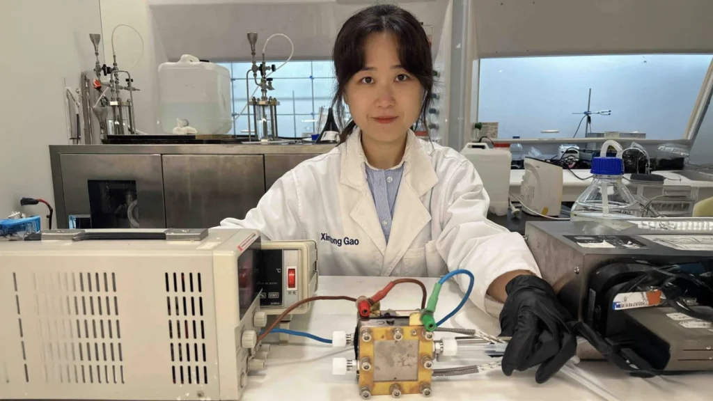 University of Adelaide PhD candidate Xintong Gao with the membrane-free urea electrolysis system.