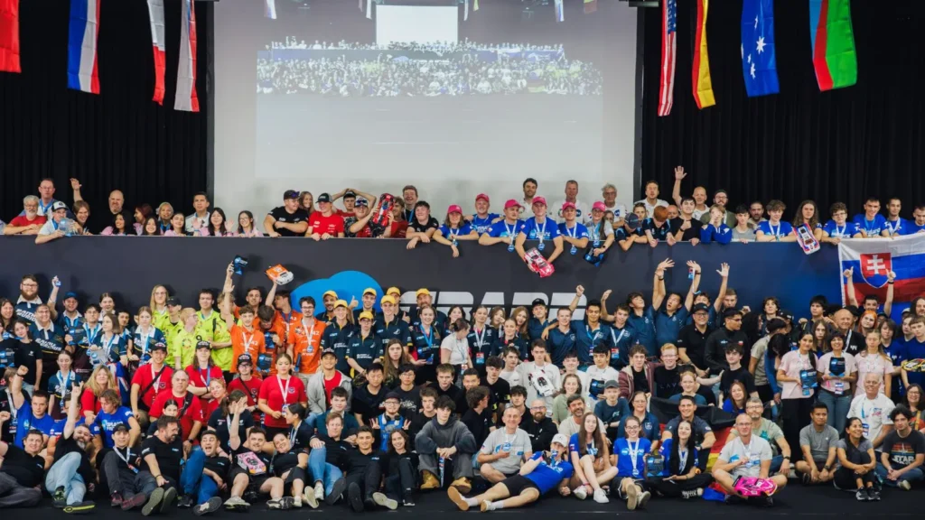 Dozens of student teams and coaches pose together for a group photo at the 2025 H2GP World Finals in Chemnitz.