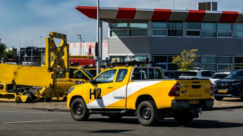 Hydrogen-powered yellow Toyota Hilux pick-up in use by Schiphol Airport’s Bird Control team.