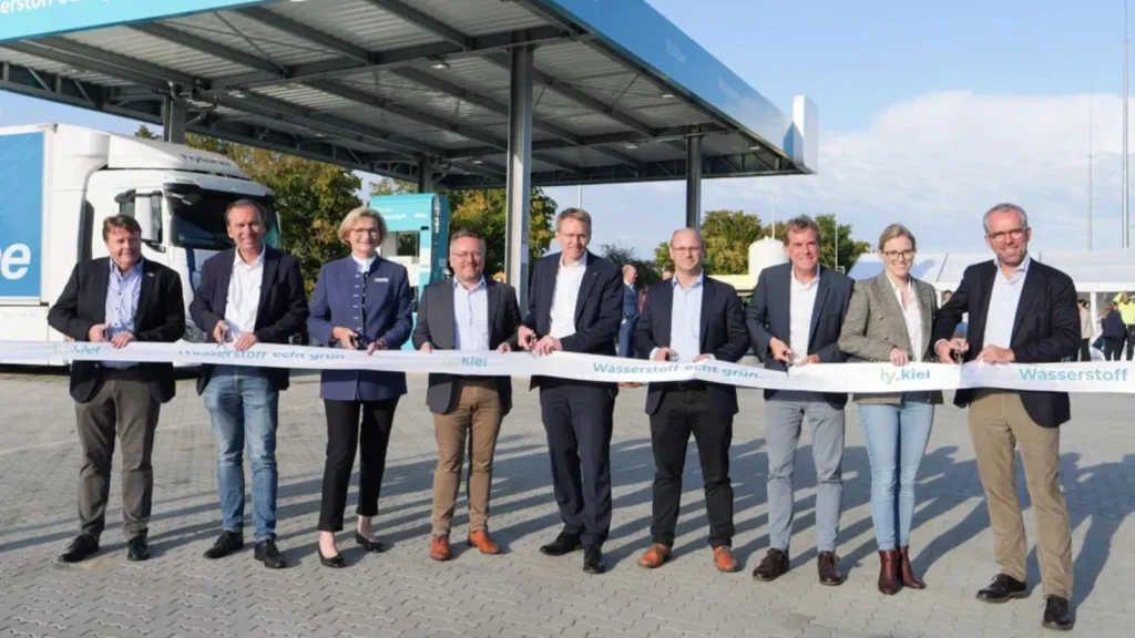 Officials and project partners cut the ribbon at the opening of the HYCEL hydrogen refuelling station in Hürup, Germany, developed by GP JOULE as part of the eFarm project.