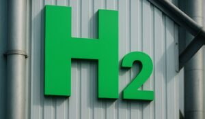 Green H₂ symbol on the side of an industrial factory building