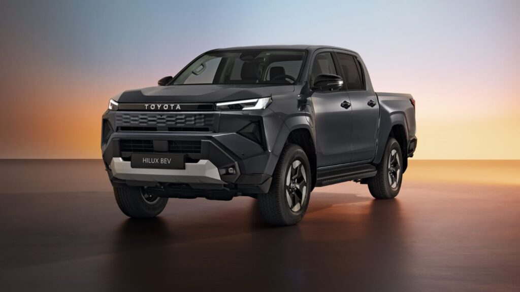 Front three-quarter view of the Toyota Hilux BEV showcasing its bold electric design and rugged stance