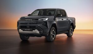 Front three-quarter view of the Toyota Hilux BEV showcasing its bold electric design and rugged stance